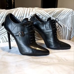 Prada high heel booties with laces in black leather